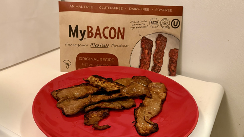 A plate of prepared MyBacon in front of its packaging