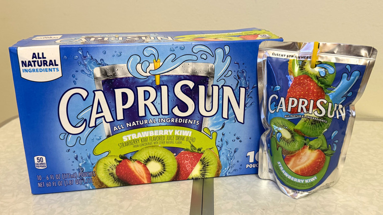 Capri Sun Strawberry Kiwi juice pouch beside its box