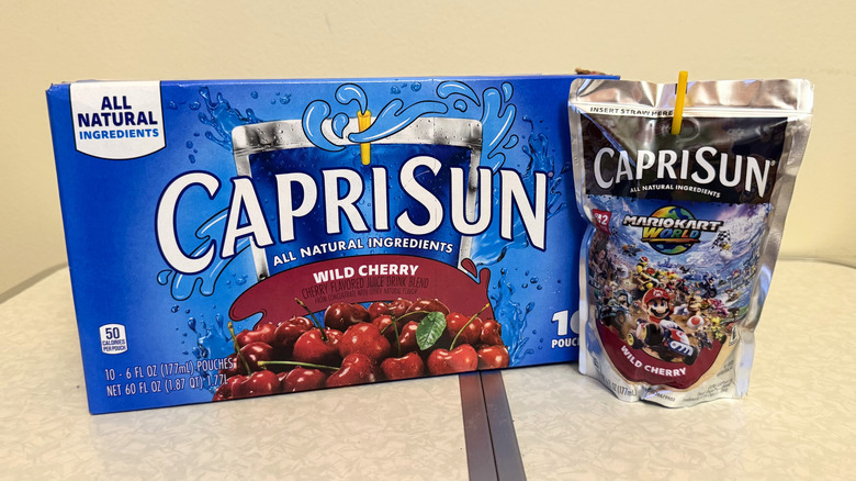 Capri Sun Wild Cherry juice pouch beside its box