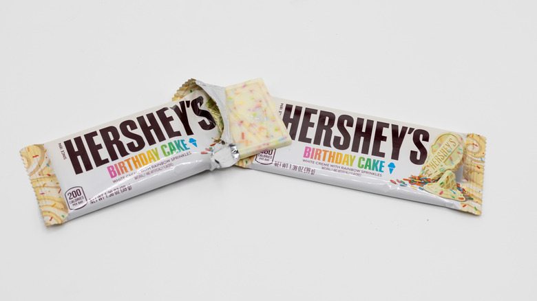 Two bars of Hershey's Birthday Cake chocolate on white background