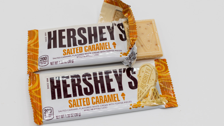 Two Hershey's Salted Caramel chocolate bars on white background