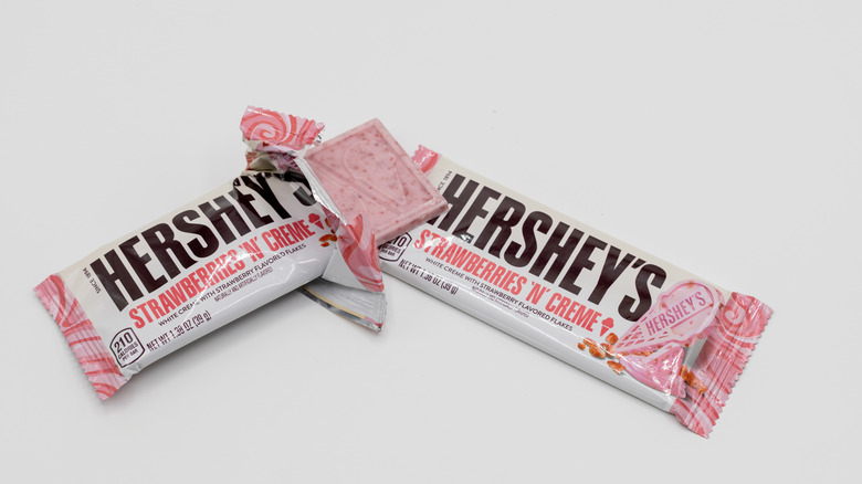 Two Hershey's Strawberries 'n' Creme bars on white background
