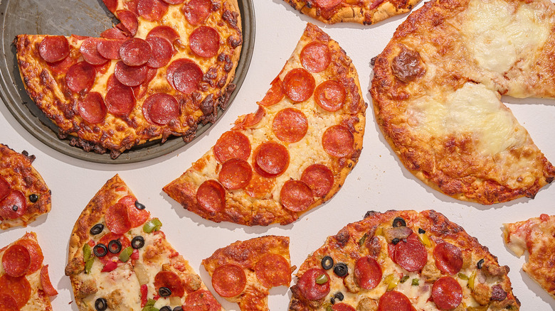 Baked pizzas arranged on a table