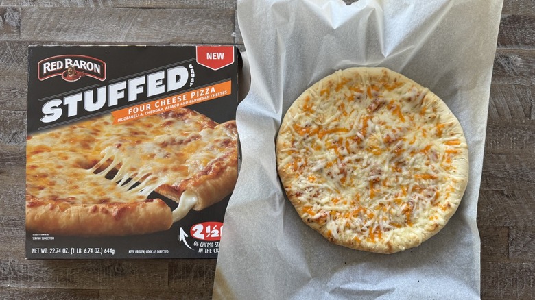 Pizza on pan with a box