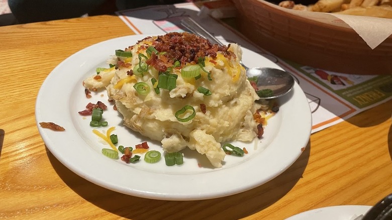 A plate of loaded mashed potatoes from Chili's