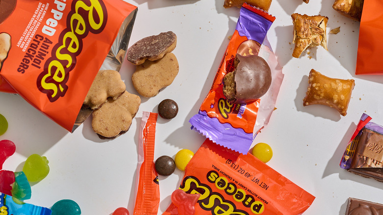 Unwrapped and eaten Halloween candies together on a table