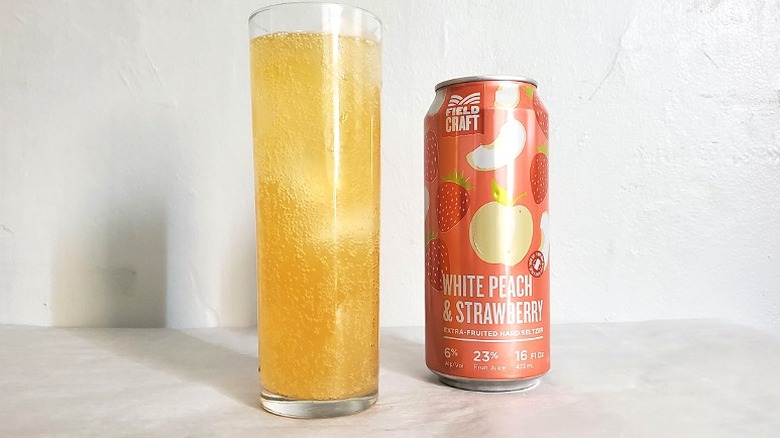 Fieldcraft white peach strawberry hard seltzer with its package