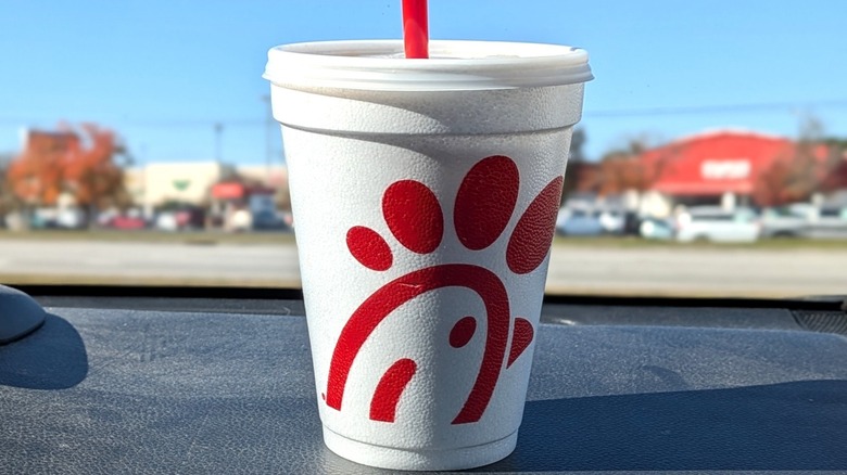 Chick-fil-A small soda on car dashboard
