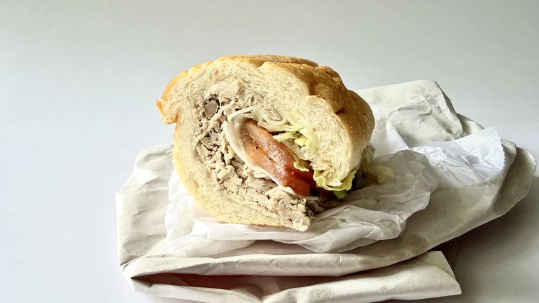 The Homemade Turkey from Capriotti's with its wrapping on a white background