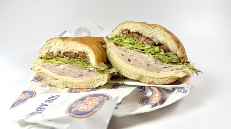 The Turkey and Provolone from Jersey Mike's with its wrapping on a white background