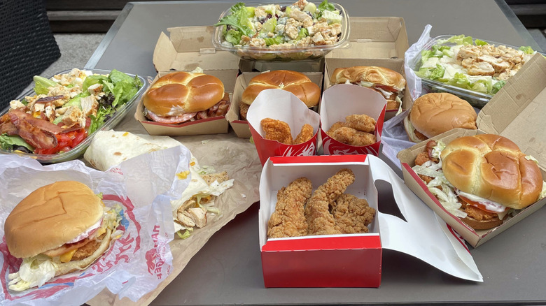 Thirteen chicken items from Wendy's on a table.