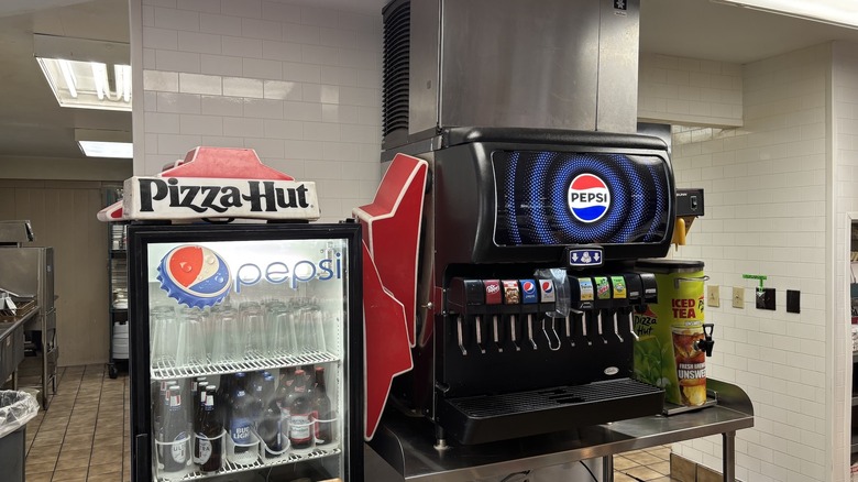 A Classic Pizza Hut logo on a drinks cooler inside the Anaconda Pizza Hut Classic
