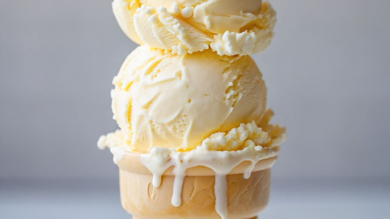 Double-scoop vanilla ice cream cone.