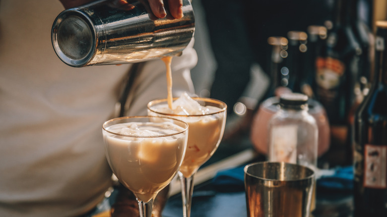 bartender pouring two cream coffee cocktails