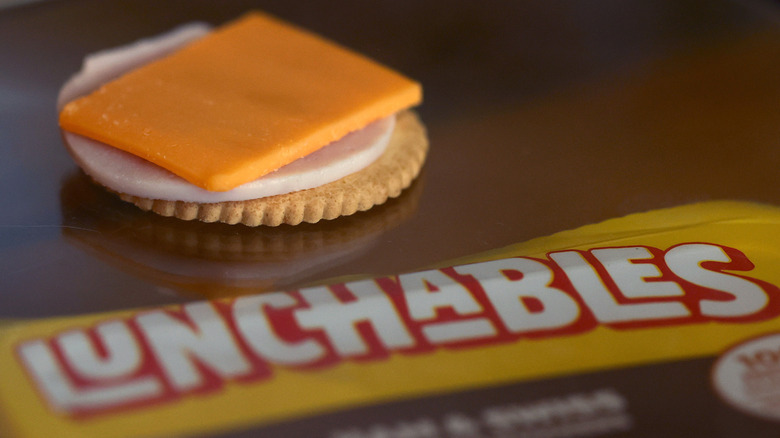 A stack of Lunchables ham and cheese on a cracker