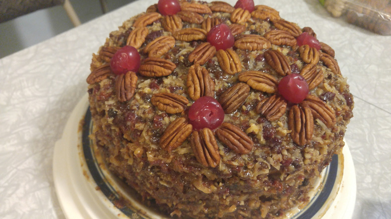 Lane Cake covered with pecans