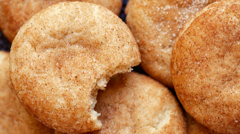 Overhead of snickerdoodles one with a bite missing