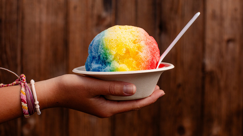 Hand holding bowl of Hawaiian shave ice