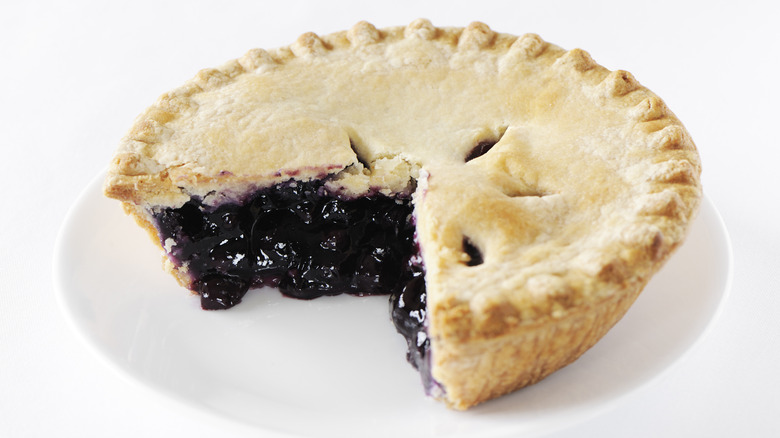 Blueberry pie with a slice cut out