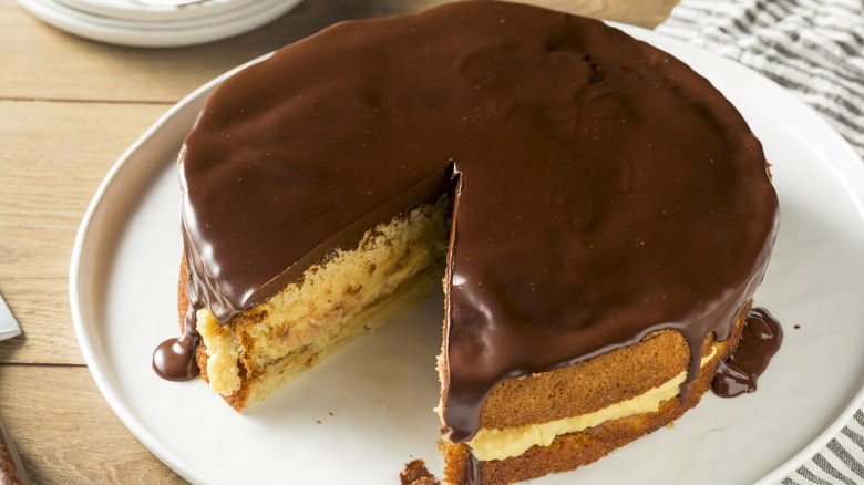 Boston cream pie with a slice cut out