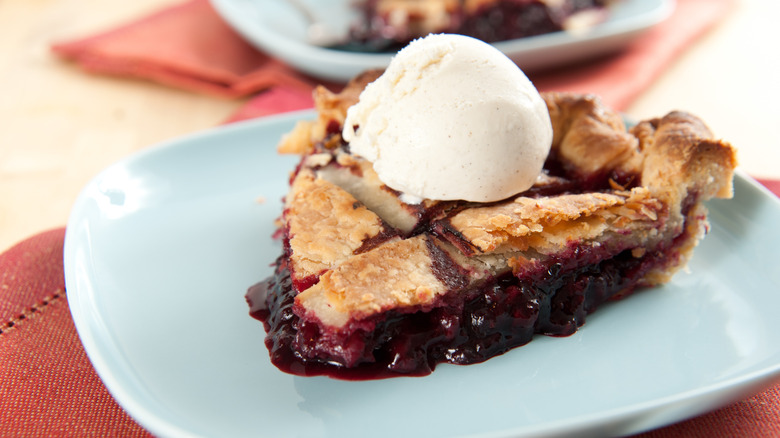 A slice of marionberry pie with ice cream