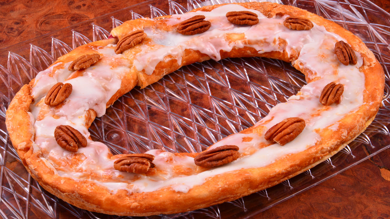 A Kringle with pecans on top