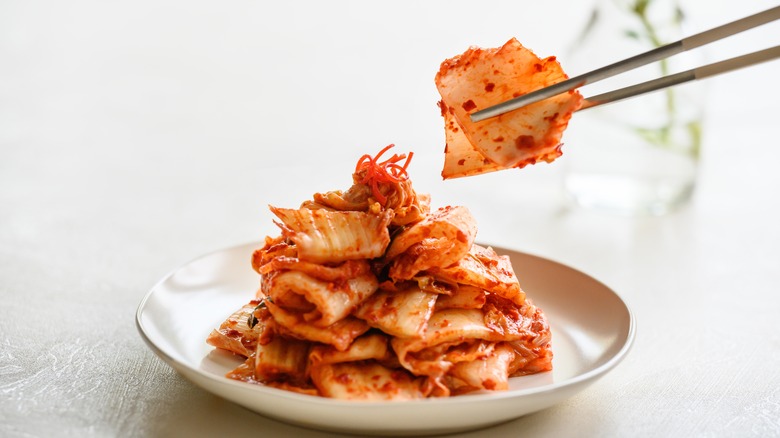 kimchi picked up with chopsticks