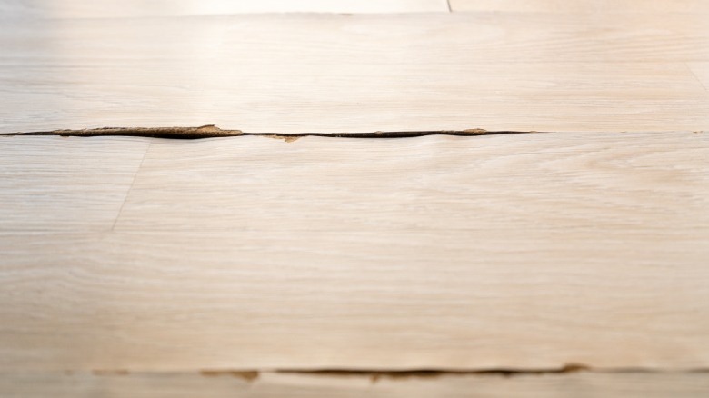 Kitchen laminate floor panels with peeling sides not ideal for Swiffer cleaning.