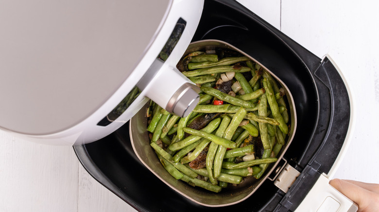 Air fryer meal, cooking green bean, pidan dishes cookery with Airfryer at home, delicious cuisine in Taiwan, Asia, Asian Taiwanese food, close up, top view.