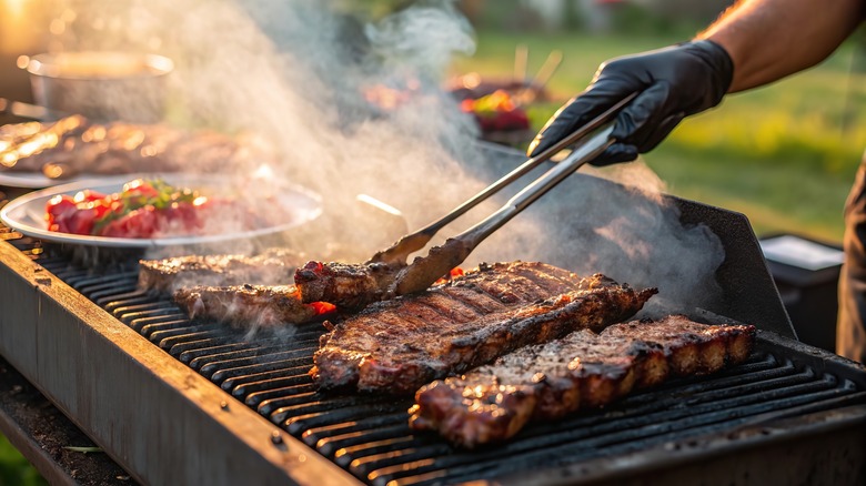 grilling ribs wearing heat resistant gloves