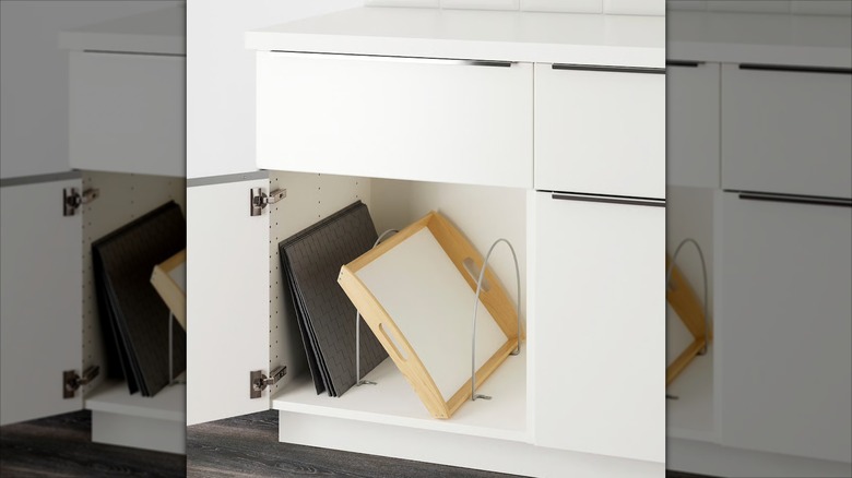 Baking trays and serving board organized with UTRUSTA partition.