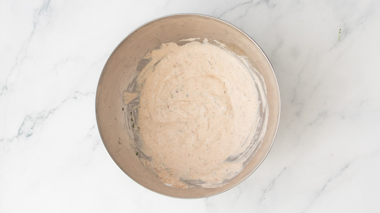 Creamy chipotle sauce in a medium metal bowl