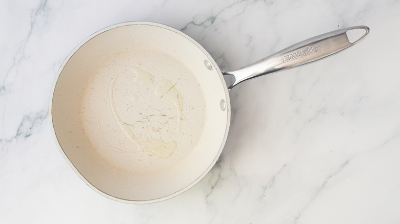 A nonstick skillet drizzled with oil