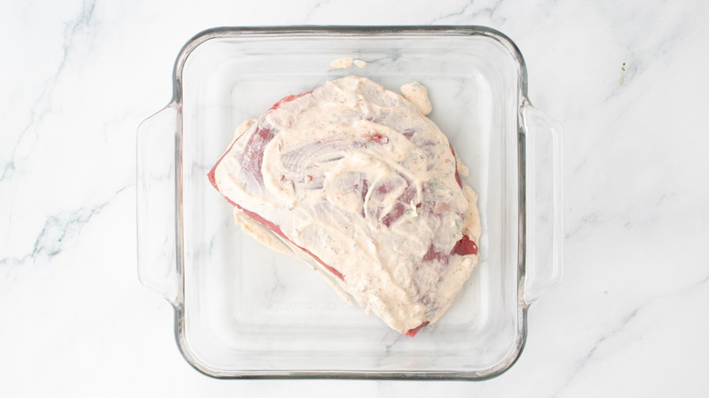 A portion of skirt steak coated in creamy chipotle sauce