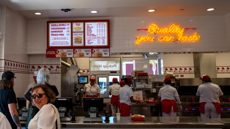 Customers wait in line to order at an In-N-Out restaurant