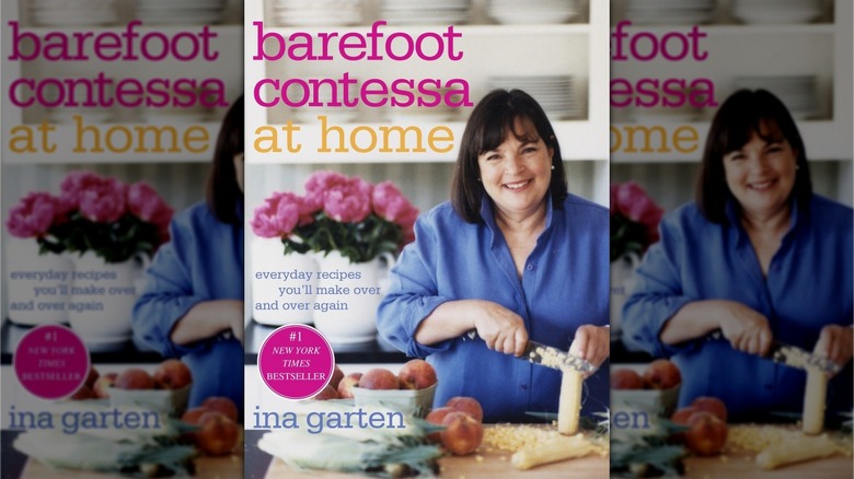 Book cover for Barefoot Contessa at home, showing Ina Garten in a kitchen preparing food and slicing kernels off a corn cob