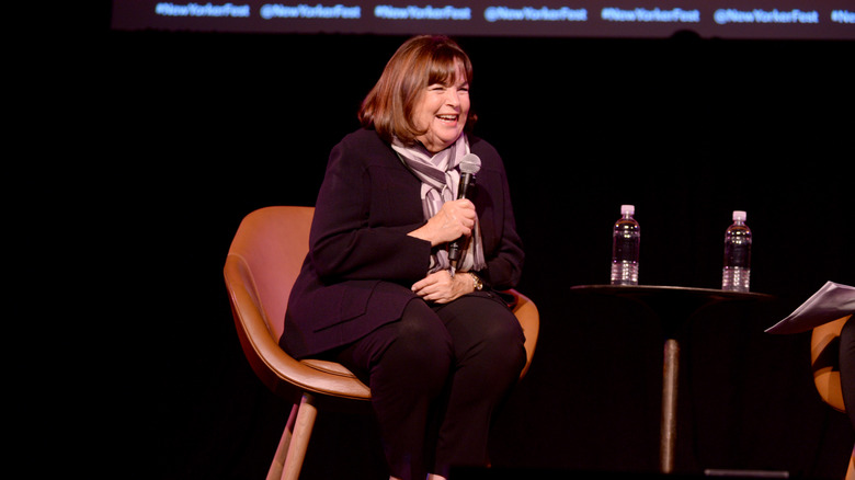 Celebrity chef Ina Garten sits on stage at an event.
