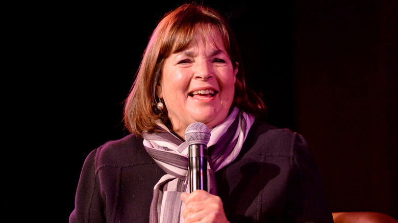 Ina Garten on stage holding a microphone