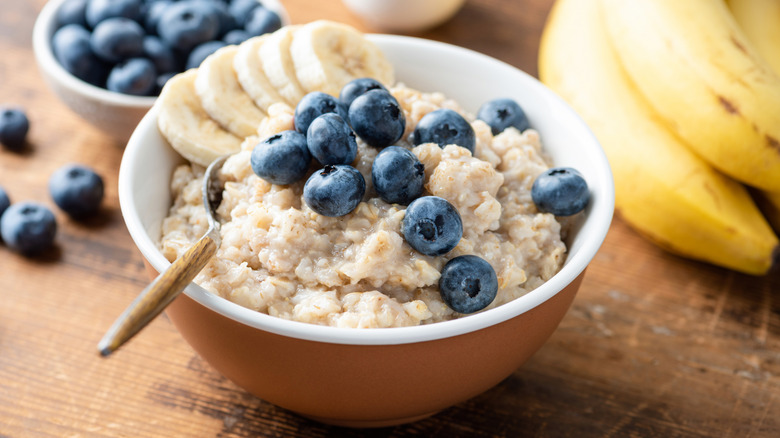a bowl of oatmeal with blueberries and banana