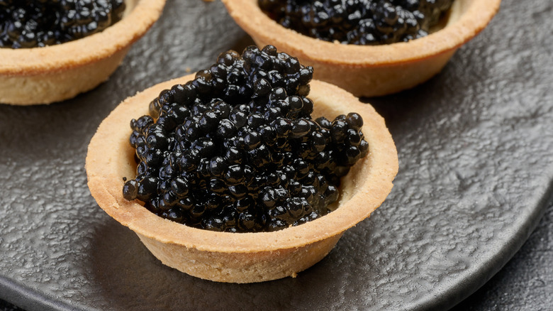 Bowls of black sturgeon caviar