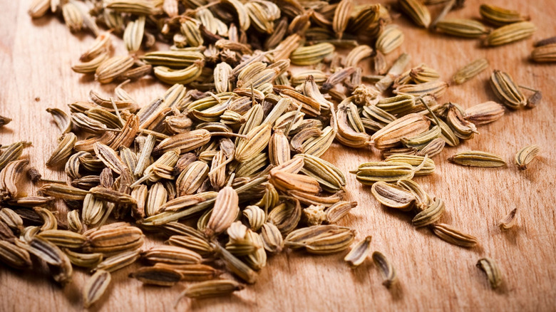 Fennel seeds on wood board
