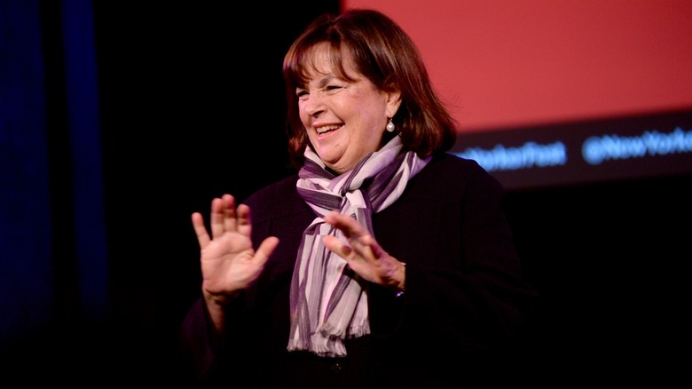 Ina Garten smiles as she speaks onstage at an event