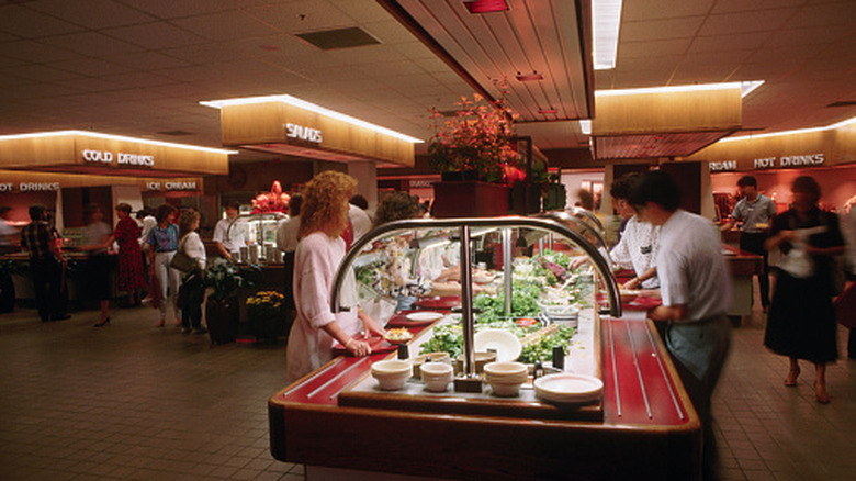 People at a salad bar in a retro image