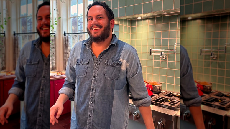 Dan Pelosi smiling in his kitchen