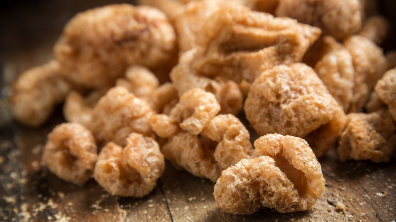A pile of pork rinds or chicharrones on a table