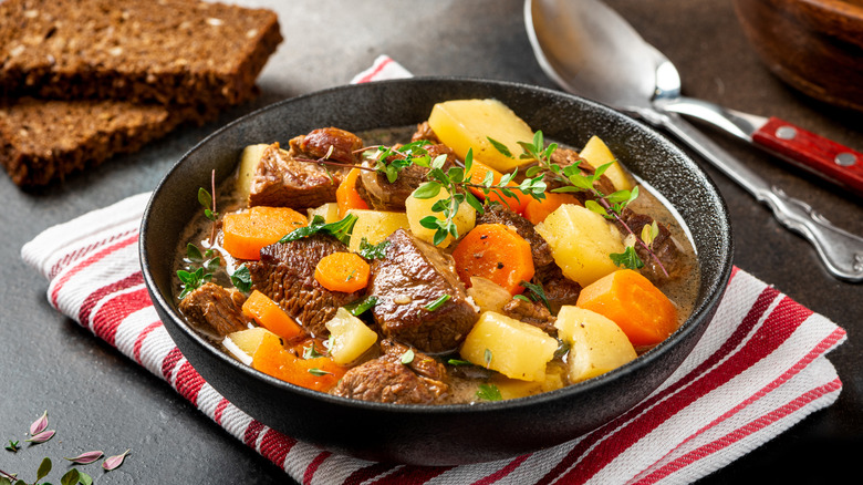 A bowl of Irish lamb stew on a striped napkin