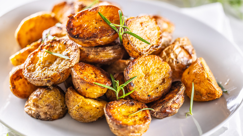 roasted potato rounds on a white plate