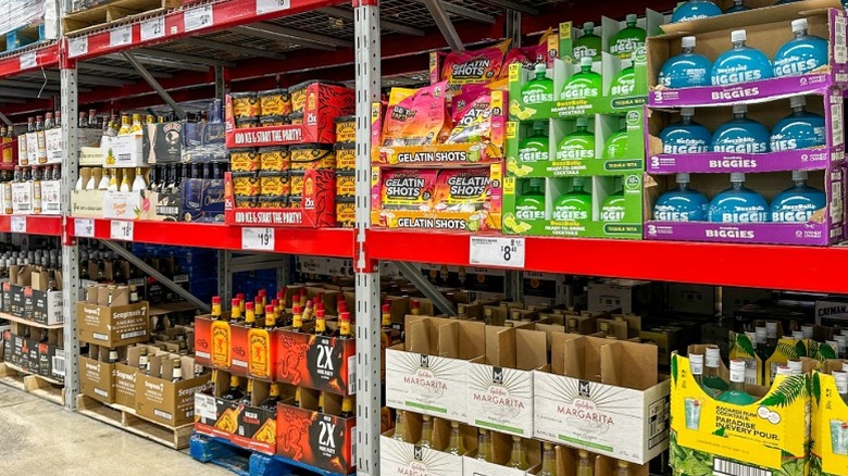 Bottles of alcohol for sale in an aisle at Sam's Club.