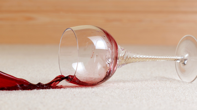 A wine glass with spilled wine