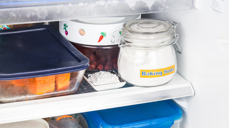 Baking soda sitting on refrigerator shelf